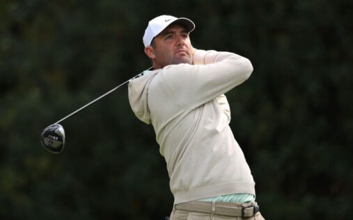 Scottie Scheffler playing a shot on the fairway at Augusta National Golf Club during the Masters tournament