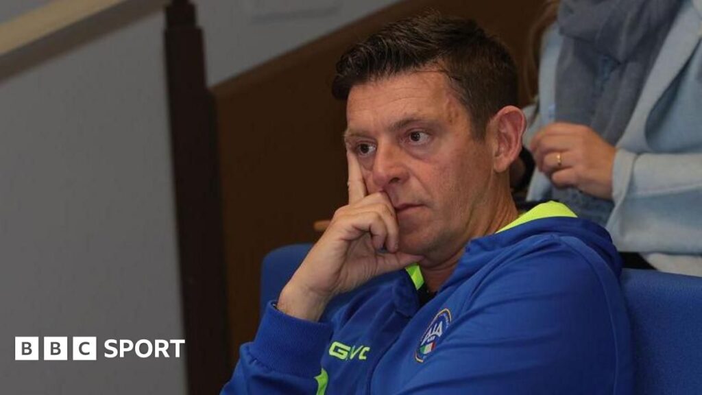Gianluca Rocchi gesturing on the pitch during an Italian Serie A football match