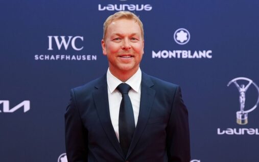 Sir Chris Hoy riding a bicycle outdoors with friends in the countryside