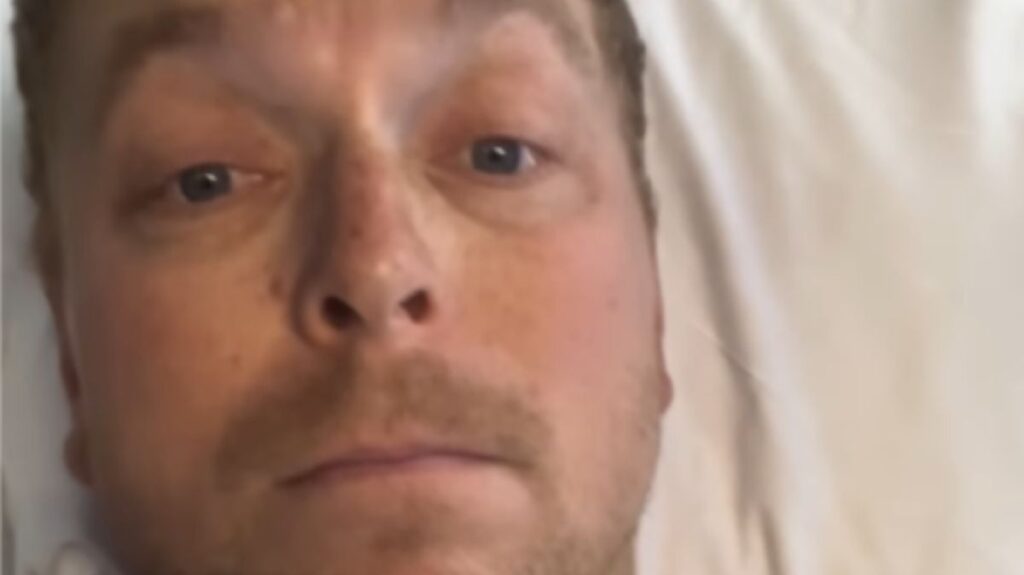 Sir Chris Hoy riding a mountain bike on a wooded trail