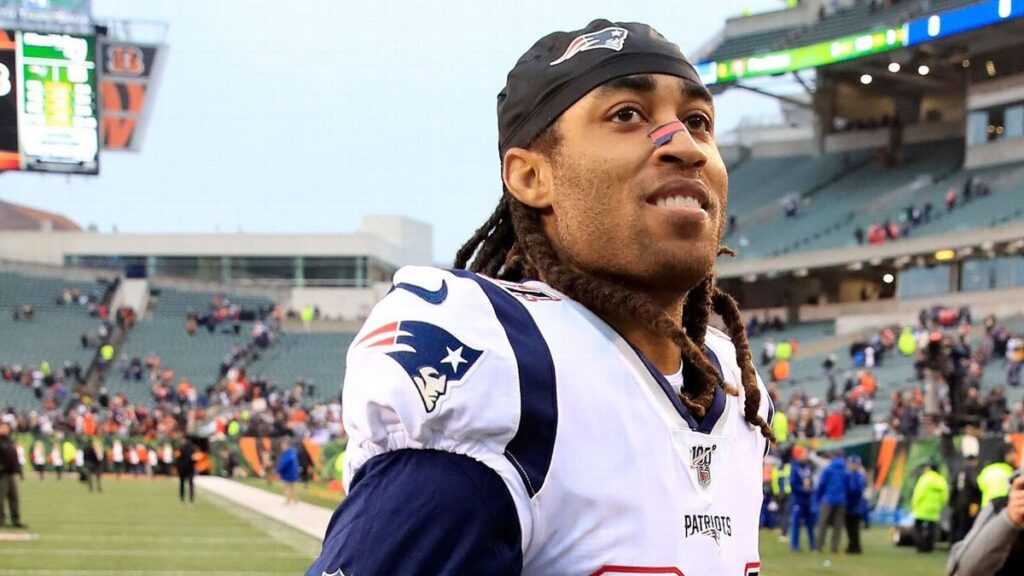 Stephon Gilmore looking on while playing for the New England Patriots