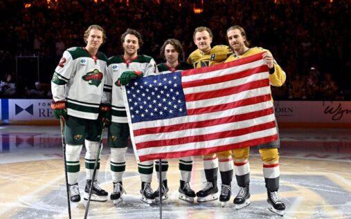 Team USA ice hockey players celebrating their Olympic gold medal victory on the ice