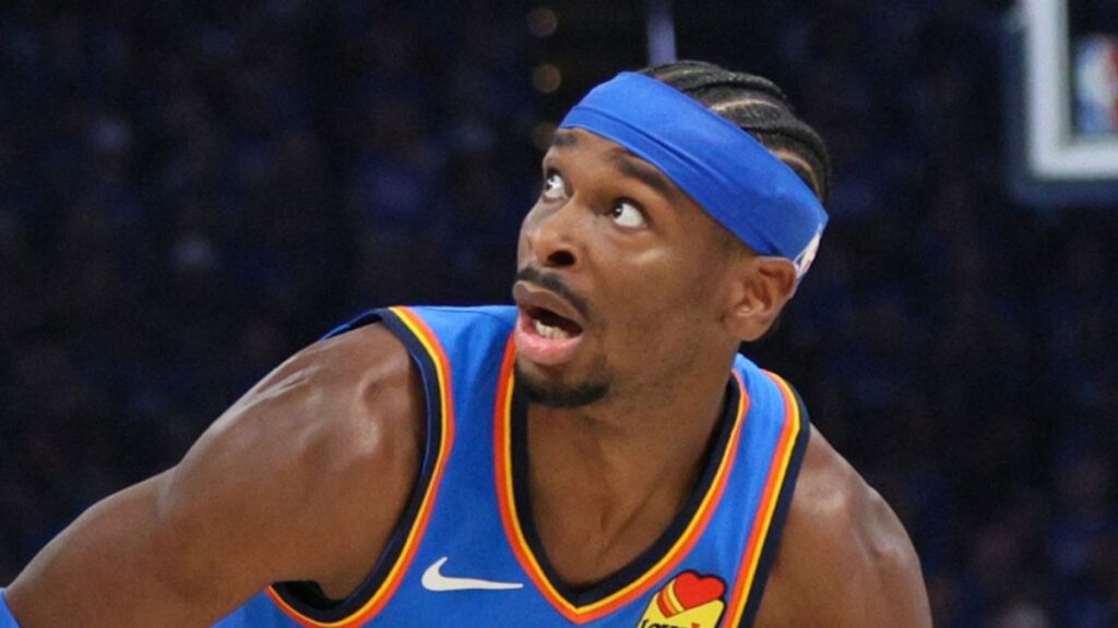 Shai Gilgeous-Alexander of the Oklahoma City Thunder driving to the basket during an NBA playoff game