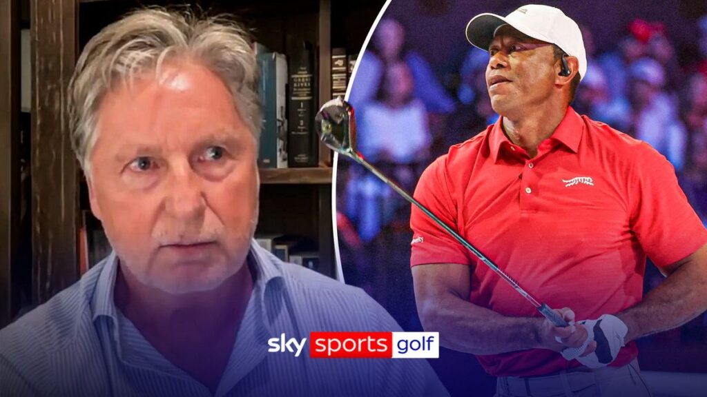 Tiger Woods looking thoughtful while walking on a golf course