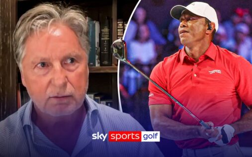 Tiger Woods looking thoughtful while walking on a golf course