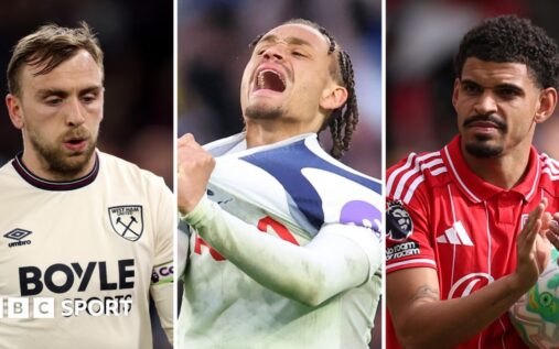 Dejected Tottenham Hotspur players looking disappointed on the pitch during a Premier League match