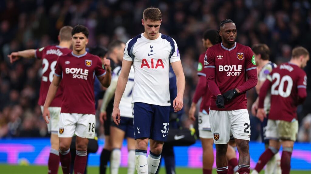 Tottenham and West Ham players battle for the ball during a tense Premier League match