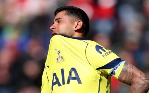 A dejected Tottenham Hotspur player looking down at the pitch during a Premier League match