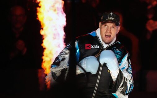 Tyson Fury celebrating in the boxing ring after defeating Arslanbek Makhmudov