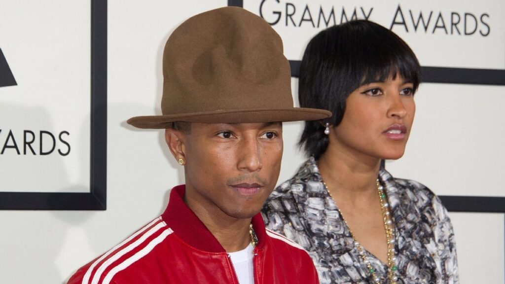 UConn Huskies basketball players celebrating on the court during the NCAA tournament