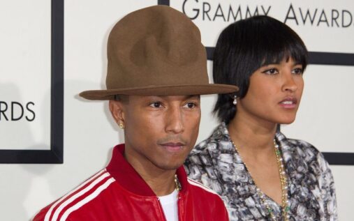 UConn Huskies basketball players celebrating on the court during the NCAA tournament