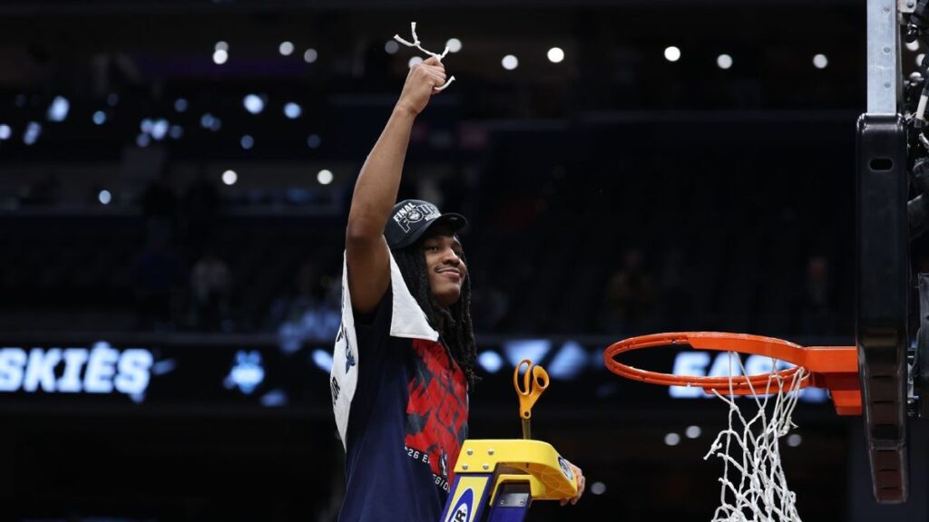 UConn point guard Silas Demary Jr dribbling the basketball on the court