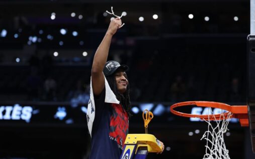 UConn point guard Silas Demary Jr dribbling the basketball on the court