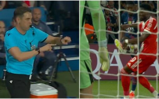 A football referee pointing to the penalty spot during a Champions League match