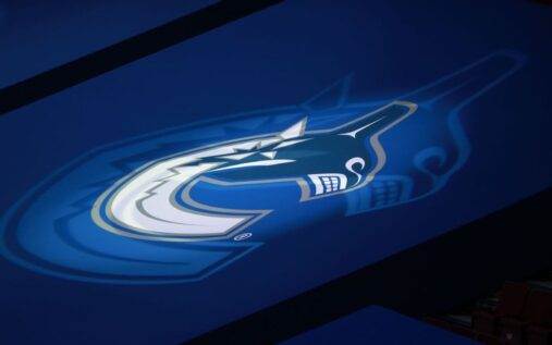 Patrik Allvin looking on from the stands during a Vancouver Canucks ice hockey match