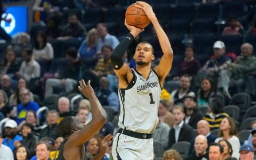 Victor Wembanyama handling the basketball for the San Antonio Spurs during an NBA match