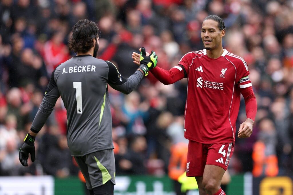 Virgil van Dijk and Alisson Becker talking during a Liverpool Premier League match