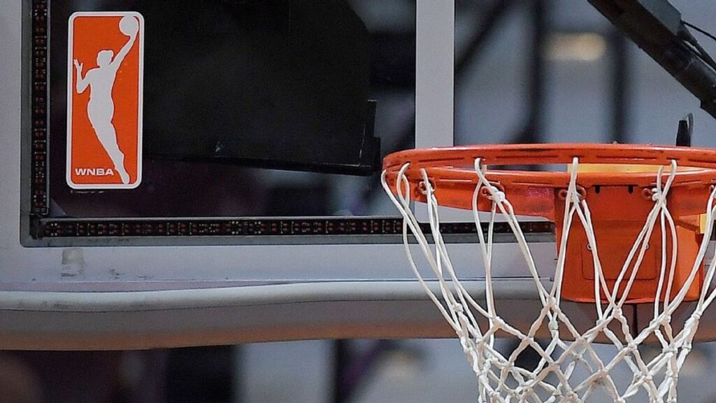 WNBA players competing on the basketball court during a live broadcast