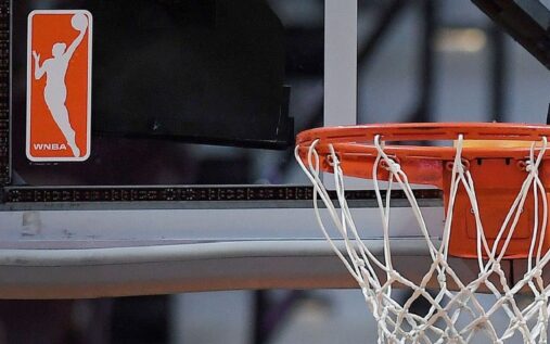 WNBA players competing on the basketball court during a live broadcast