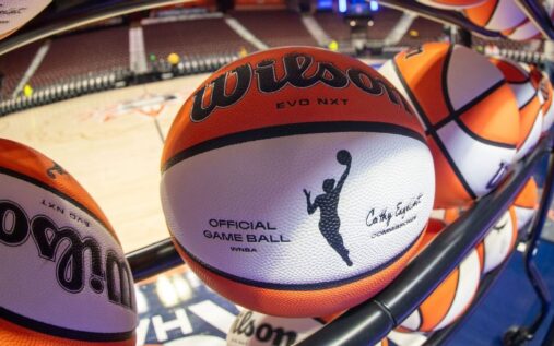 WNBA players competing on court during a professional basketball game