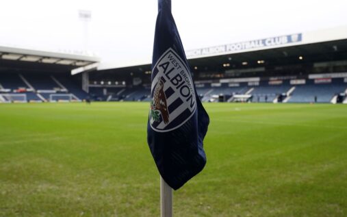West Bromwich Albion players looking dejected on the pitch during a Championship match