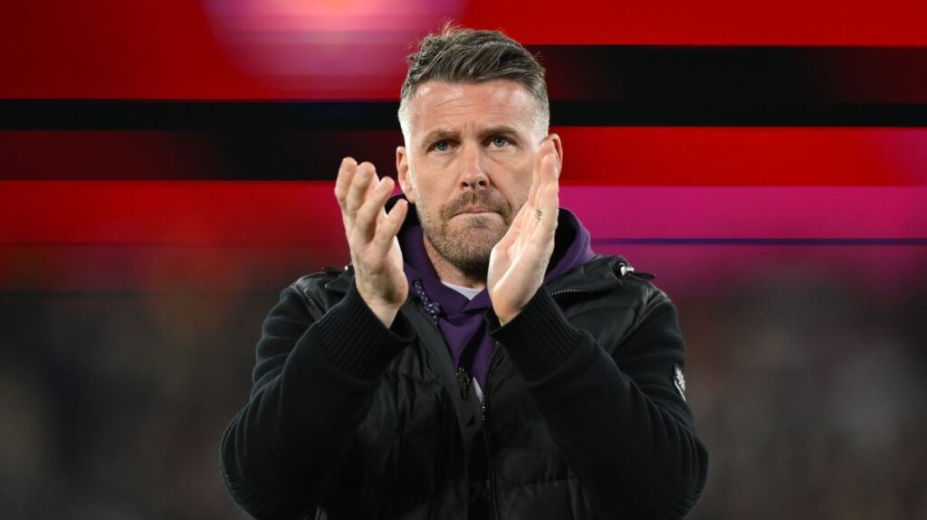 Dejected Wolverhampton Wanderers players reacting on the pitch