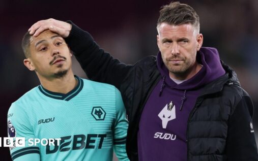 Dejected Wolverhampton Wanderers players walking off the pitch after confirming relegation