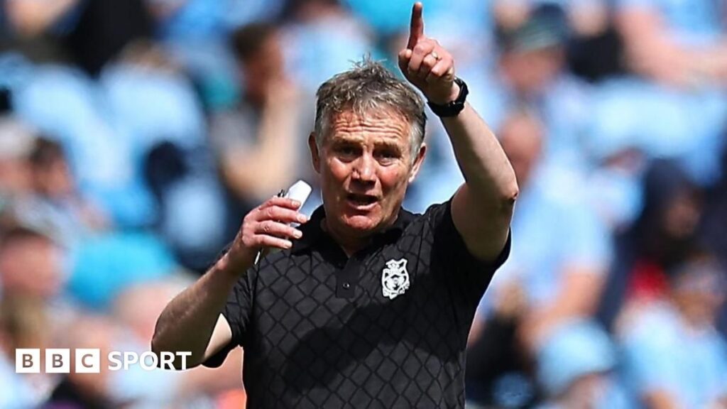 Wrexham manager Phil Parkinson directing his players from the touchline