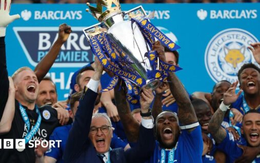 Marc Albrighton and Wes Morgan celebrating with the Premier League trophy