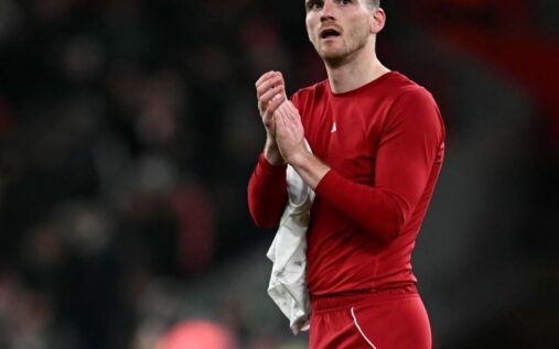 Andy Robertson clapping and waving to Liverpool supporters at Anfield