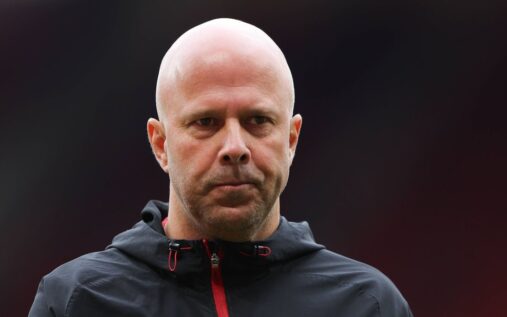 Liverpool manager Arne Slot looking thoughtful on the touchline during a Premier League match