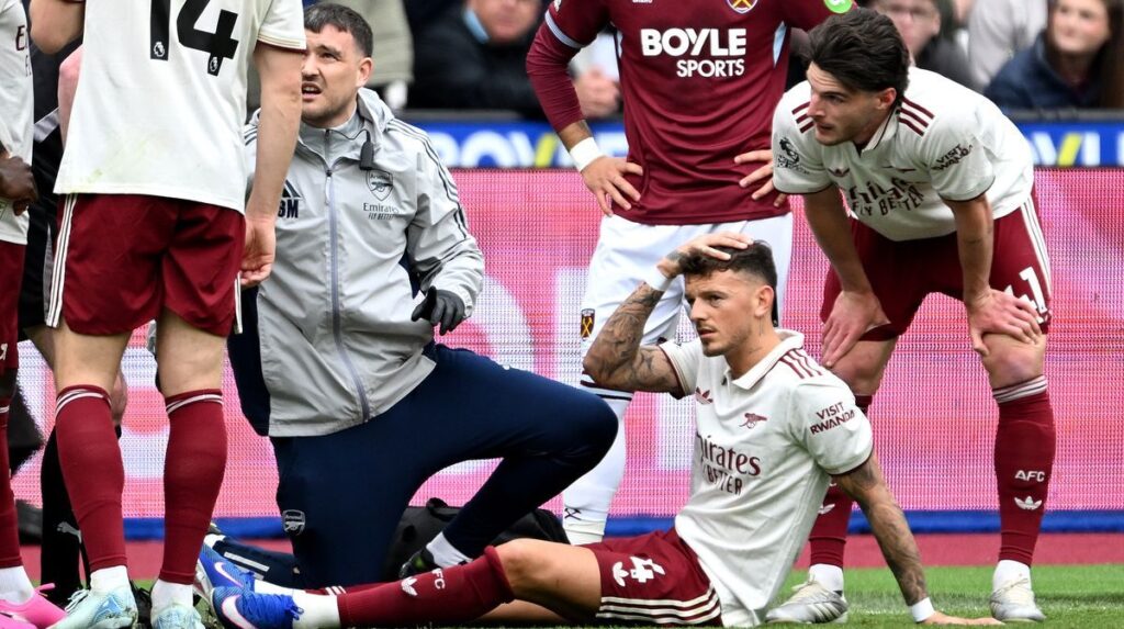 Arsenal defender Ben White looking dejected while being substituted off the pitch due to injury