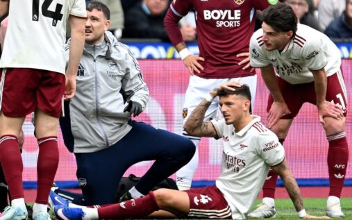 Arsenal defender Ben White looking dejected while being substituted off the pitch due to injury