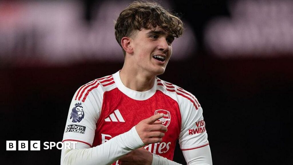 Arsenal teenager Max Dowman holding the Premier League trophy