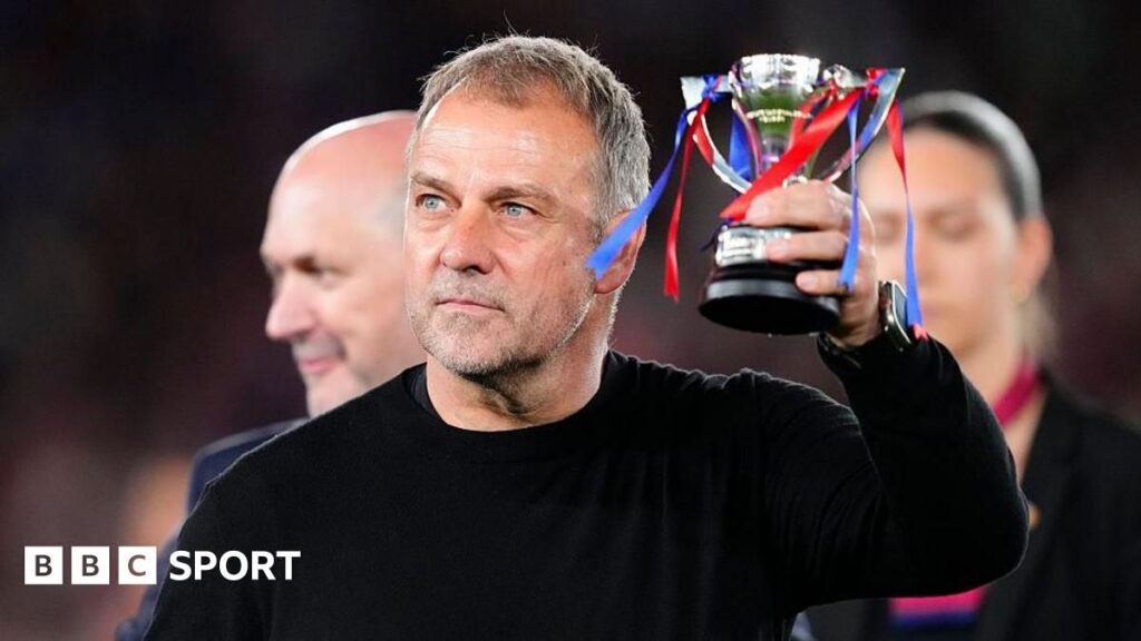 Barcelona manager Hansi Flick applauding fans on the touchline during a La Liga match