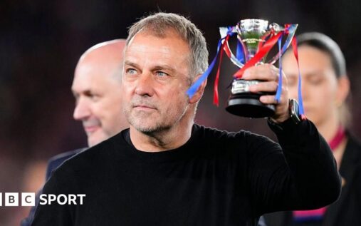 Barcelona manager Hansi Flick applauding fans on the touchline during a La Liga match