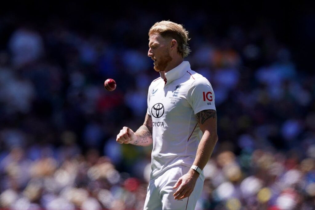 Ben Stokes wearing his Durham county cricket kit preparing to bowl a delivery on the pitch