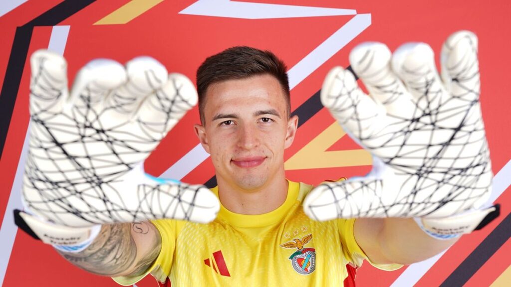Anatoliy Trubin celebrating in his Benfica goalkeeper kit during a Champions League match