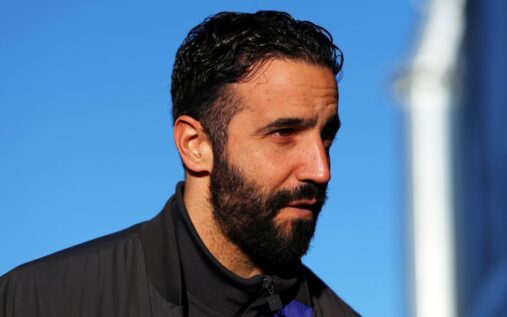 Ruben Amorim standing on the touchline wearing a suit