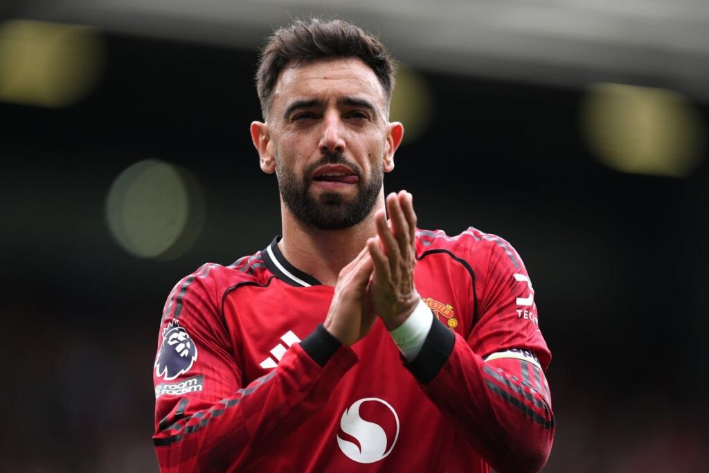 Bruno Fernandes applauding the fans during a Manchester United Premier League match