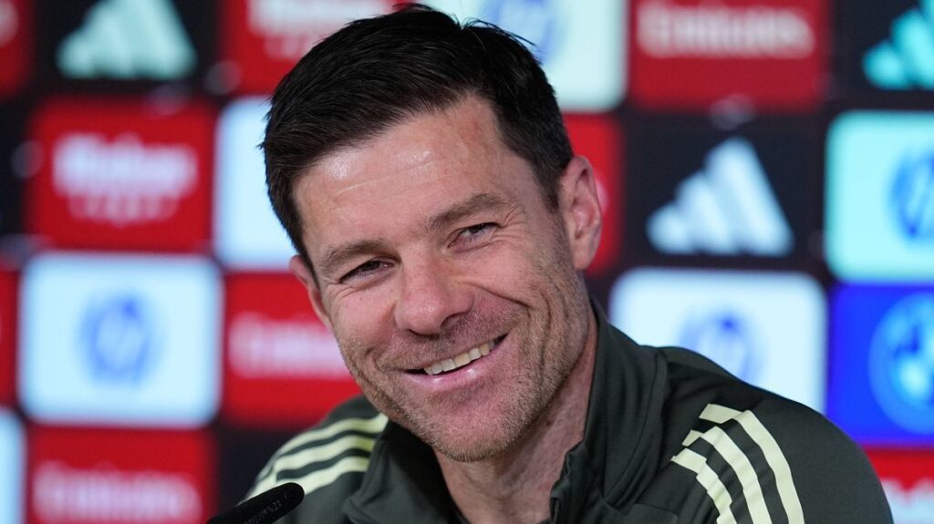 Xabi Alonso giving tactical instructions on the touchline