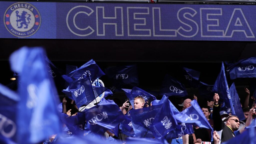 Chelsea football fans marching and protesting outside Wembley Stadium before an FA Cup match