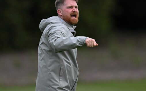 Chelsea manager Calum McFarlane looking determined on the touchline during a match