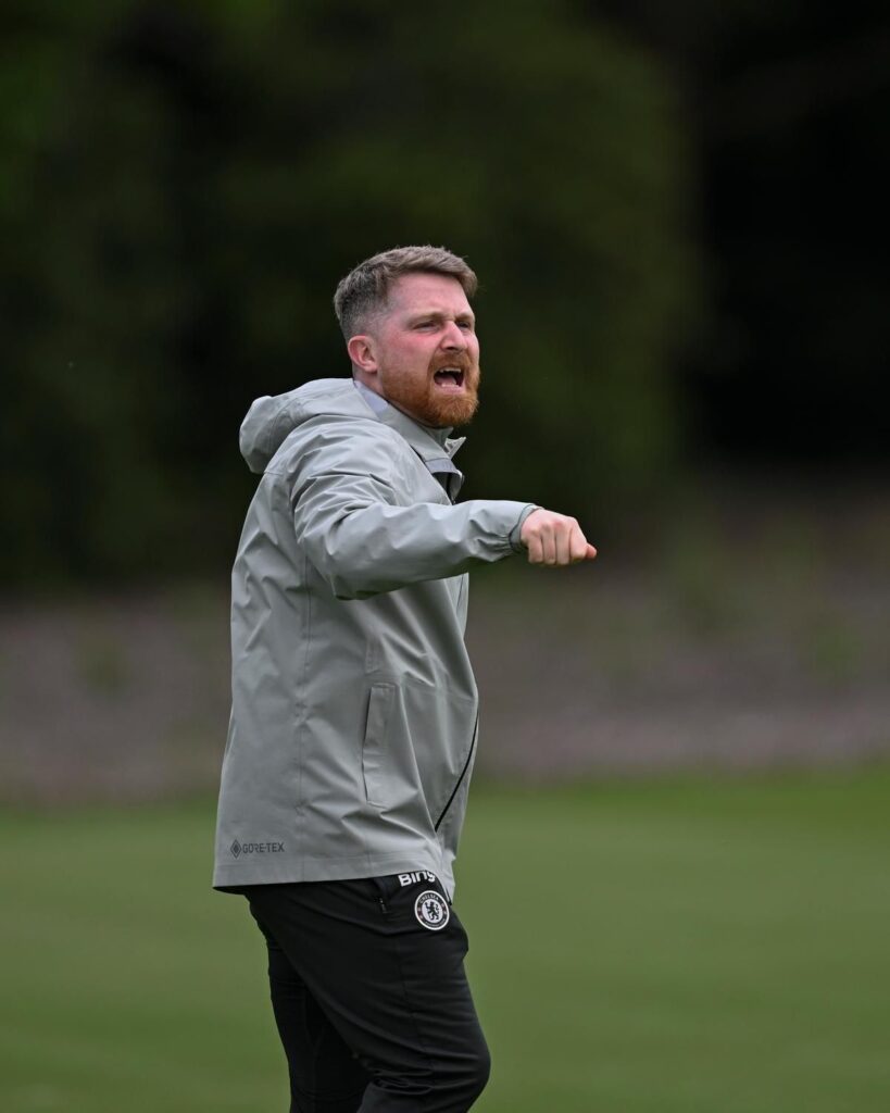 Chelsea manager Calum McFarlane looking determined on the touchline during a match