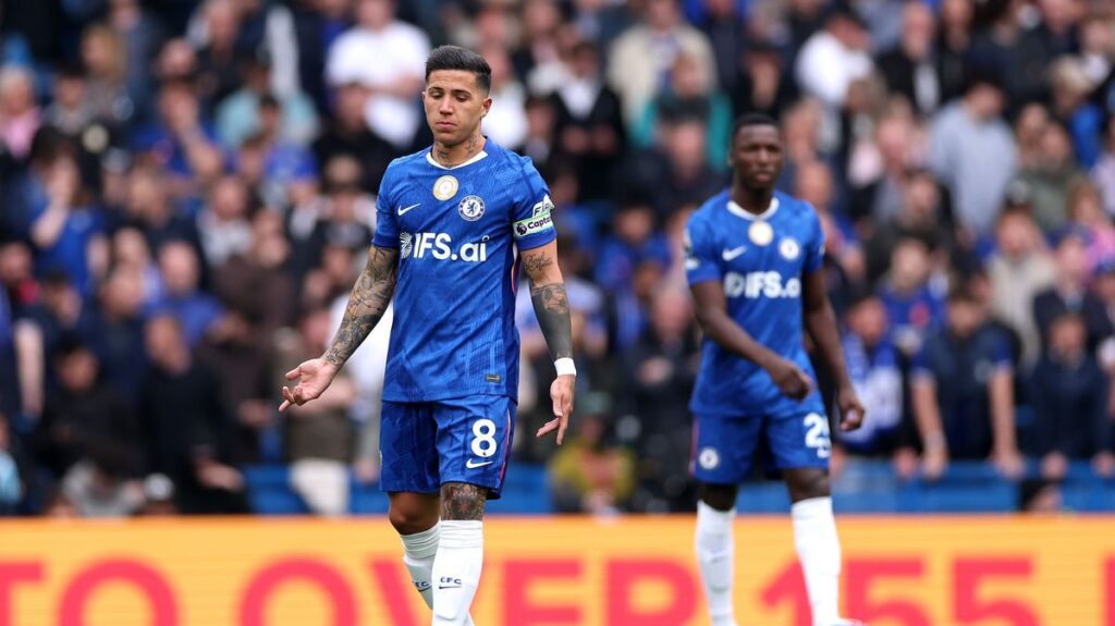 Dejected Chelsea players react on the pitch during their Premier League defeat to Nottingham Forest