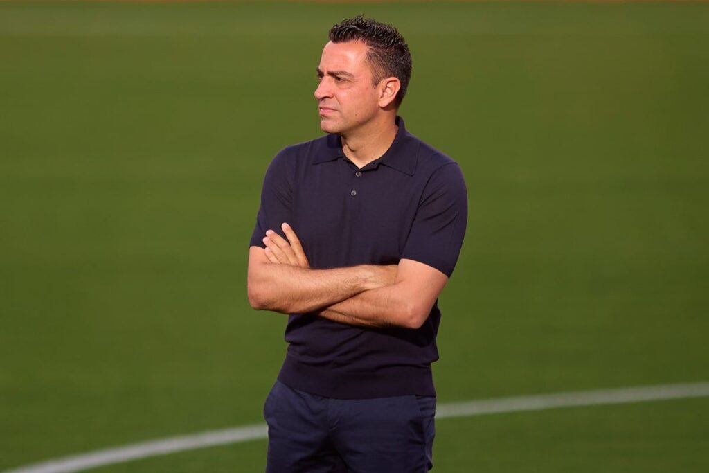 Xavi Hernandez standing on the touchline and giving instructions during a match