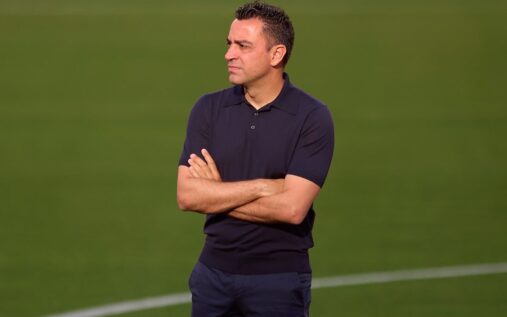 Xavi Hernandez standing on the touchline and giving instructions during a match