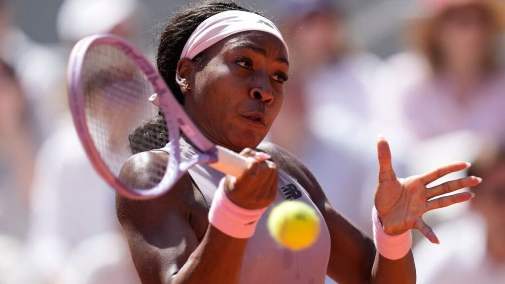Coco Gauff hitting a forehand on the clay courts of Roland-Garros during her first-round French Open victory