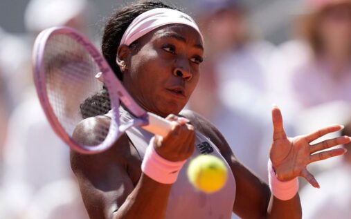 Coco Gauff hitting a forehand on the clay courts of Roland-Garros during her first-round French Open victory