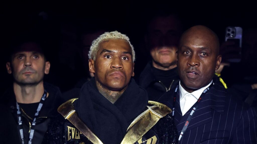 Conor Benn and Ryan Garcia facing off intensely inside a boxing ring